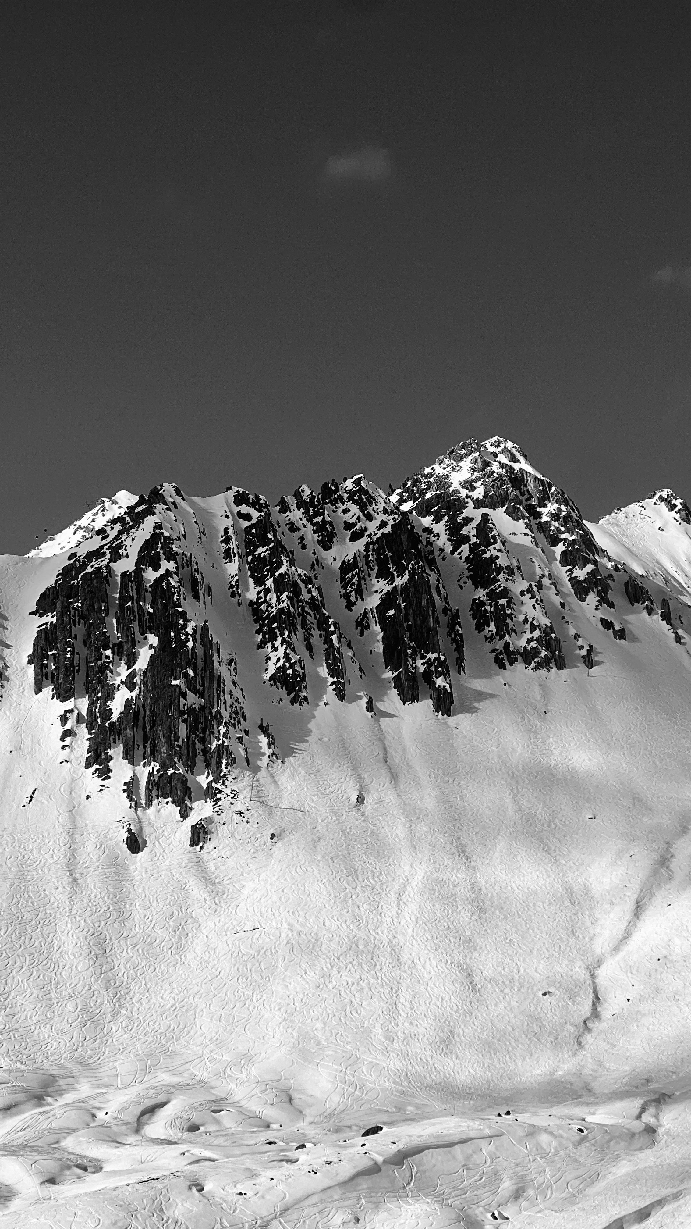 Snowy mountain peak with a clear sky